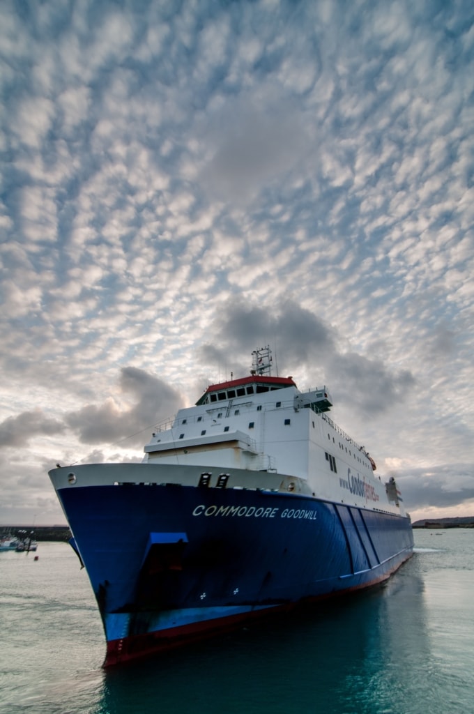 Condor Ferries arriving at the harbour at sunset with beautiful clouds in the sky, Albert Pier, St. Helier Harbour, St. Helier, Jersey, Channel Islands