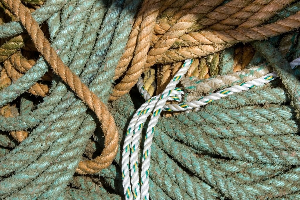 Pile of fishing ropes on Bonne Nuit Pier, Bonne Nuit Bay, St. John, Jersey, Channel IslandsPile of fishing ropes on Bonne Nuit Pier, Bonne Nuit Bay, St. John, Jersey, Channel Islands