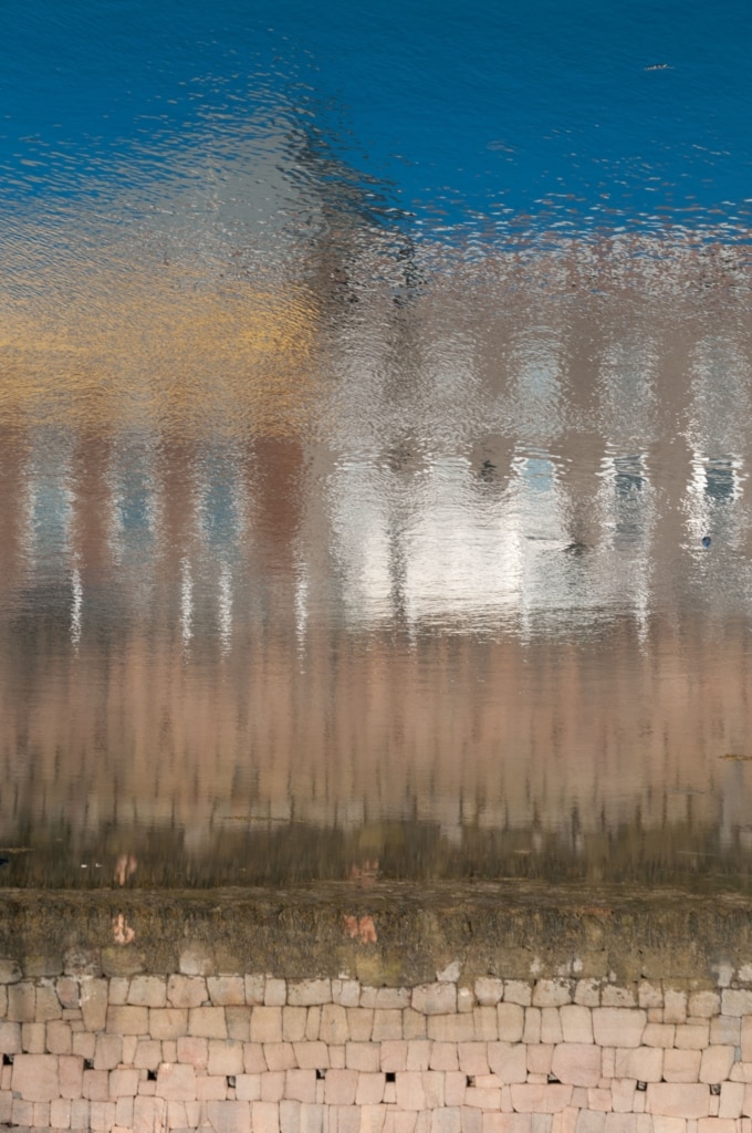 Fort Regent Swimming Pool reflected in the Old Harbour, St. Helier, Jersey, Channel Islands