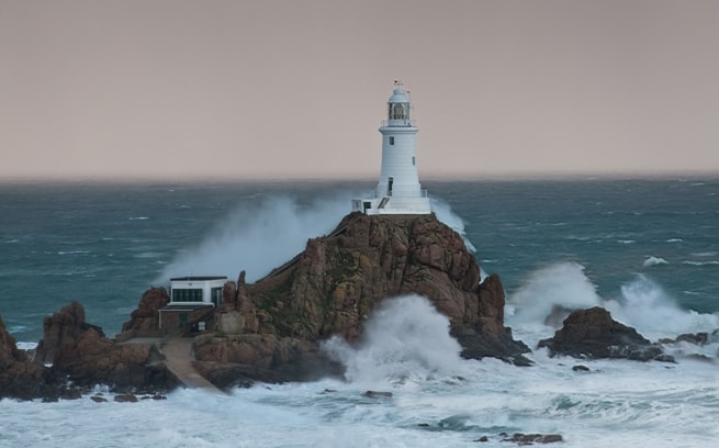 Gale force waves hitting Corbiere Lighthouse, St. Brelade, Jersey, Channel Islands