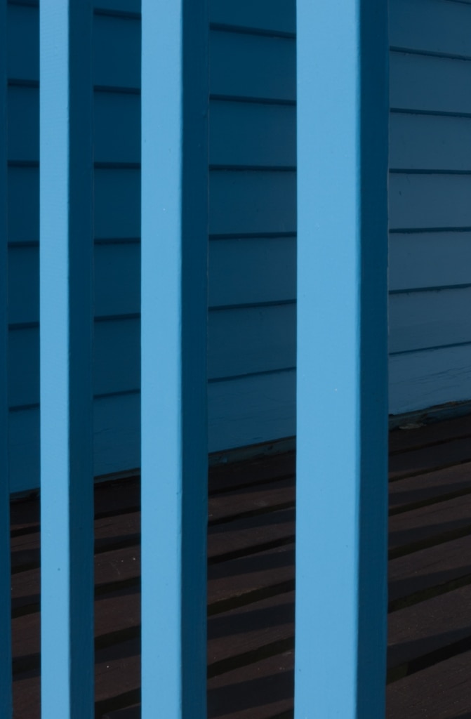 Geometric lines of a blue beach hut on Rozel Pier, Rozel Bay, St. Martin, Jersey, Channel Islands