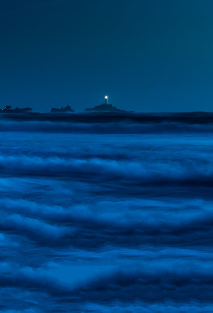 Night waves looking towards Corbiere Lighthouse, Le Braye, St. Brelade, St. Ouen's Bay, Jersey, Channel Islands