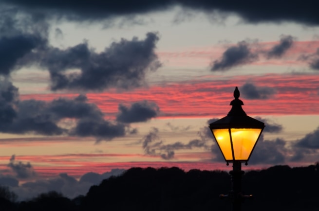 Old fashioned street lamp at sunset on Gorey Pier, St. Martin, Jersey, Channel Islands