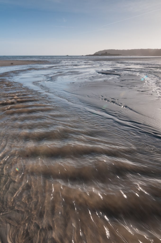 Outflow stream on the beach at St. Aubin's Bay, St. Lawrence, Jersey, Channel Islands