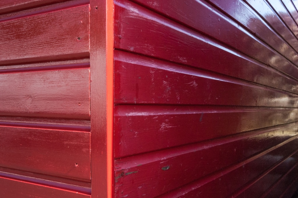 Painted red fishing hut on Rozel Pier, Rozel Bay, St. Martin, Jersey, Channel Islands