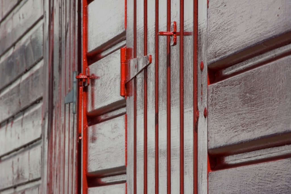 Painted red fishing hut on Rozel Pier, Rozel Bay, St. Martin, Jersey, Channel Islands