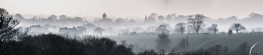 Panorama of the fog and mist, trees and fields, in the St. Lawrence countryside, Jersey, Channel Islands