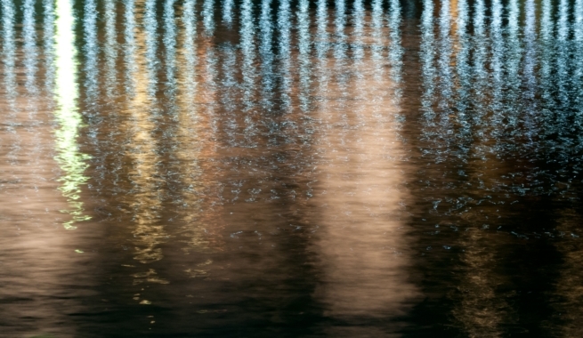 Promenade lighting reflected in the water at St. Aubin's Harbour, St. Aubin, St. Brelade, Jersey, Channel Islands