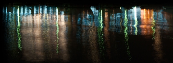 Promenade lighting reflected in the water at St. Aubin's Harbour, St. Aubin, St. Brelade, Jersey, Channel Islands