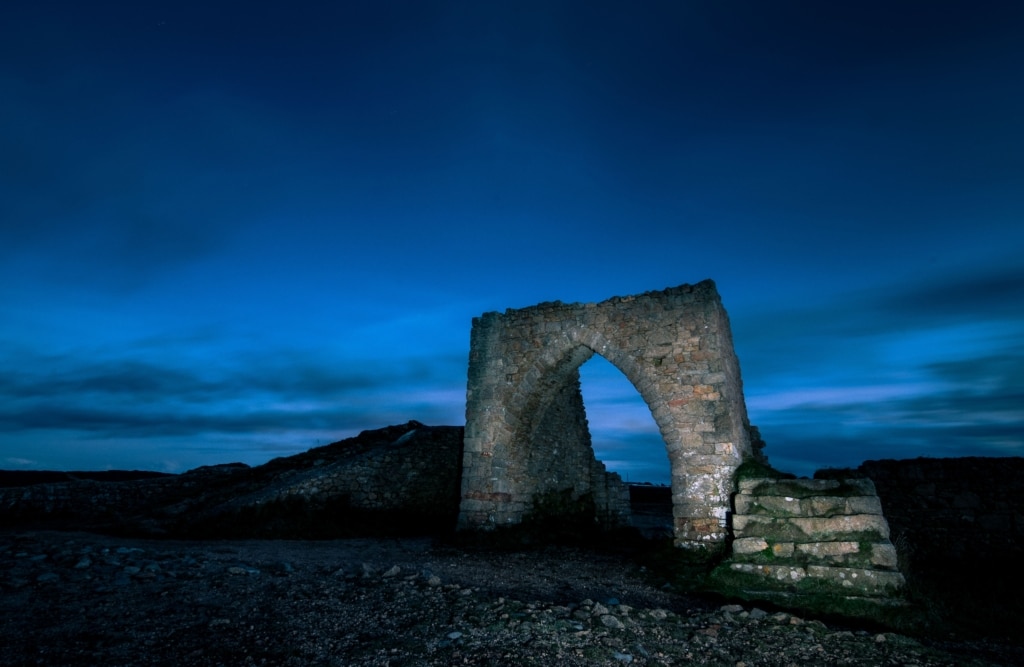 Rear view of Grosnez Castle lit up at night with a torch, St. Ouen, Jersey, Channel Islands