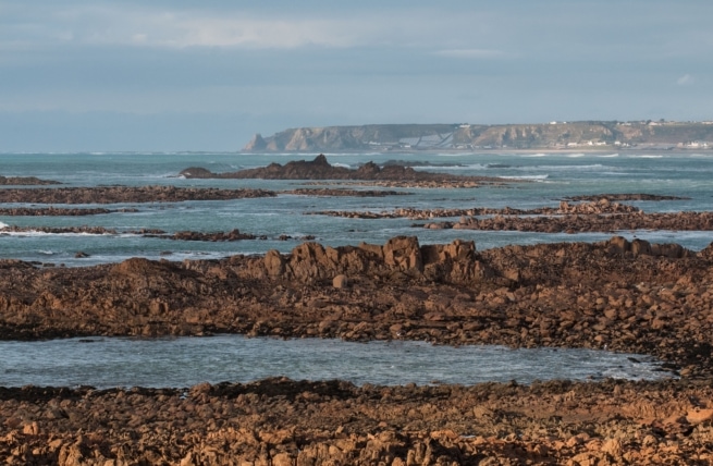 View across the rocks and St. Ouen's Bay, taken from Le Grouet, St. Brelade, Jersey, Channel Islands