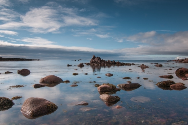 Rocks as the tide comes in at Petit Port, St. Brelade, Jersey, Channel Islands