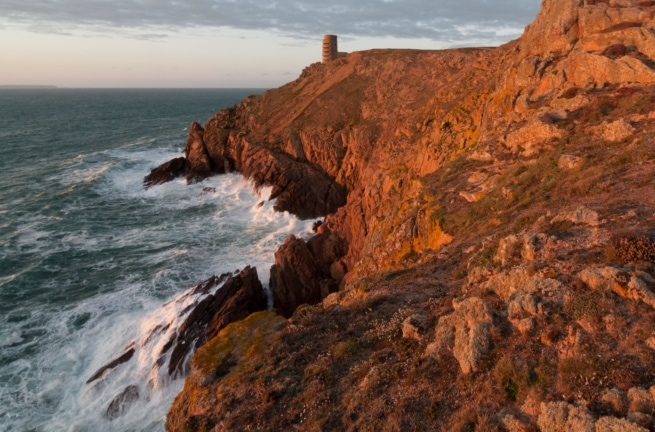 Rough seas from the cliff path looking towards MP3 Tower at Les Landes, St. Ouen, Jersey, Channel Islands