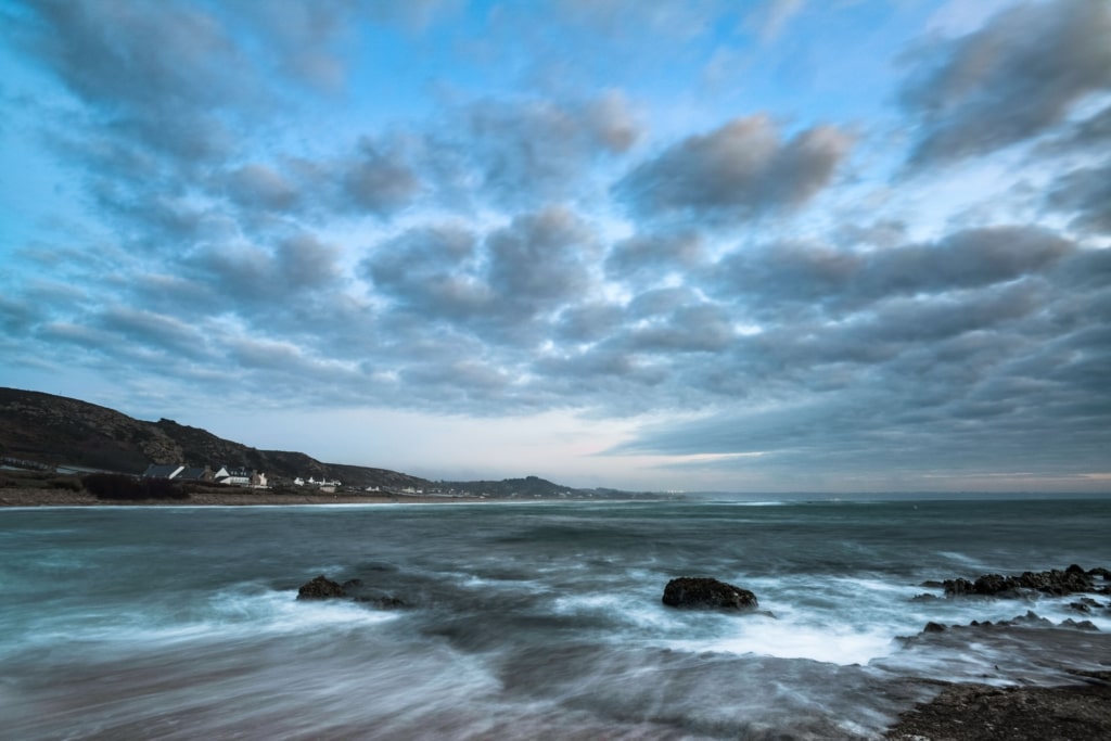 Long exposure seascape showing waves and clouds from the slipway at L'Etacq, St. Ouen, Jersey, Channel Islands