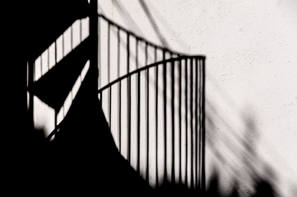 Shadow of a spiral staircase on a wall, St. Brelade, Jersey, Channel Islands