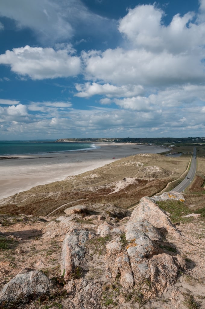 St. Ouen's Bay and fluffy clouds from the headland at La Carriere, St. Brelade, Jersey, Channel Islands