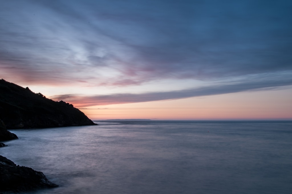 Sunset at Greve De Lecq looking along the North Coast towards Sark, St. Ouen, Jersey, Channel Islands