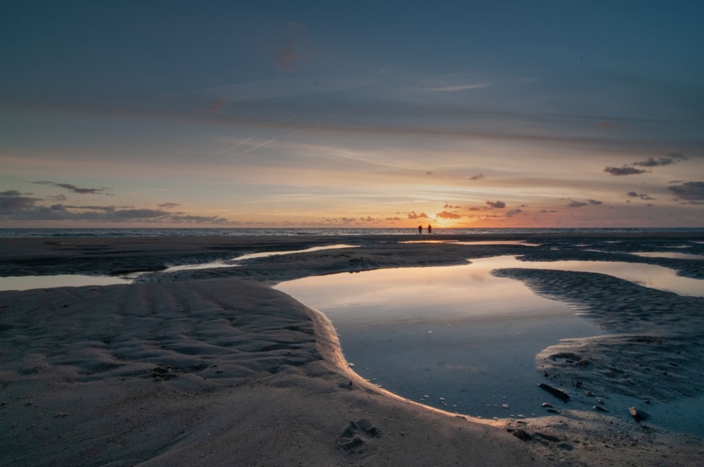 Sunset in the sand puddles at St. Ouen's Bay, St. Ouen, Jersey, Channel Islands