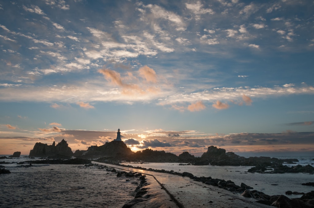 Sunset on Corbiere Lighthouse causeway, St. Brelade, Jersey, Channel Islands