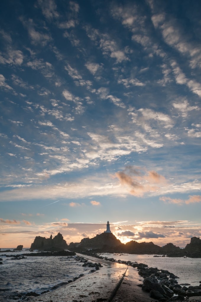 Sunset on Corbiere Lighthouse causeway, St. Brelade, Jersey, Channel Islands