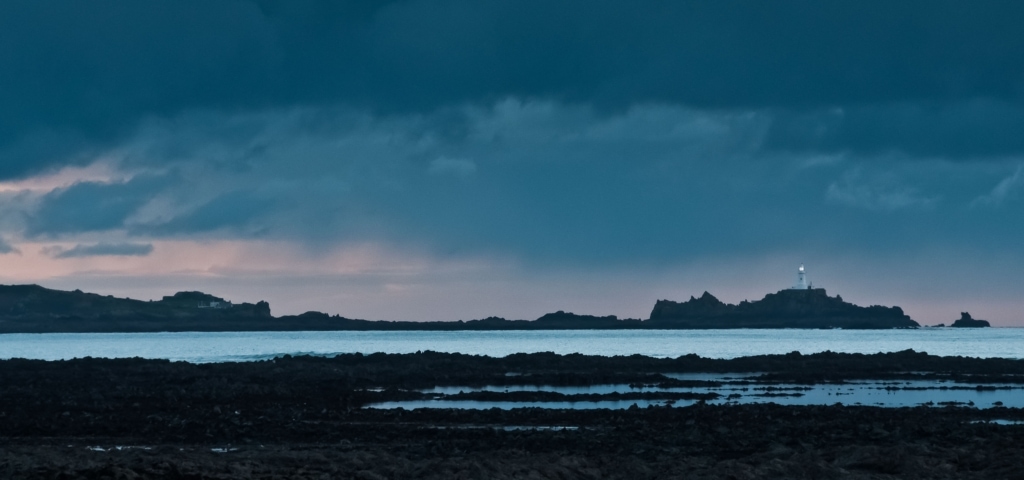 View accross the bay to Corbiere Lighthouse, L'Etacq, St. Ouen's Bay, St. Ouen, Jersey, Channel Islands