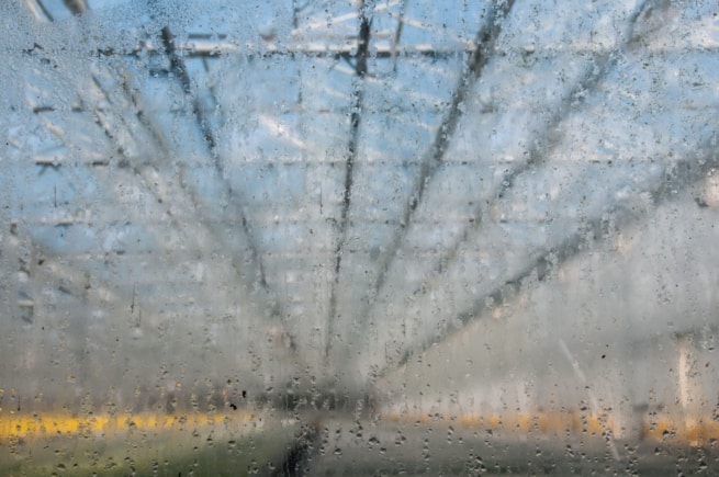 Warm air condensing on the inside of a greenhouse window, St. Lawrence, Jersey, Channel Islands