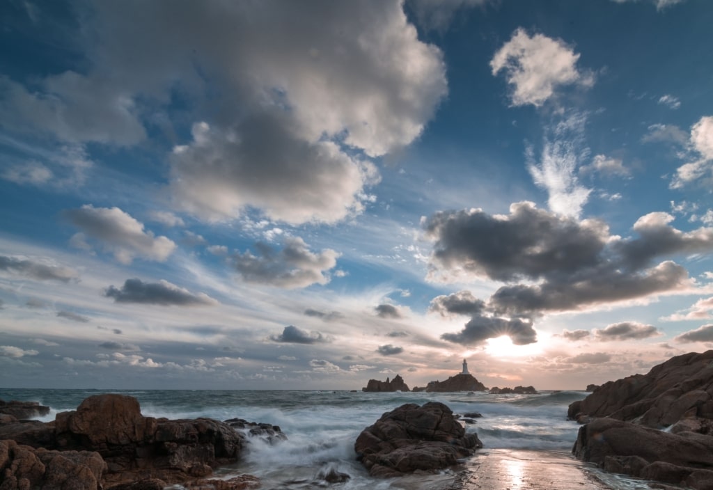 Windswept sea and clouds at sunset, Corbiere Lighthouse, St. Brelade, Jersey, Channel Islands